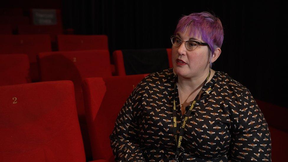 A woman sitting in a cinema