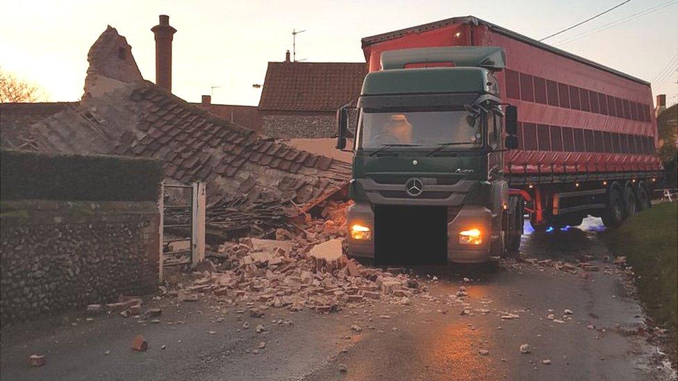 A lorry which has crashed into a building at Binham