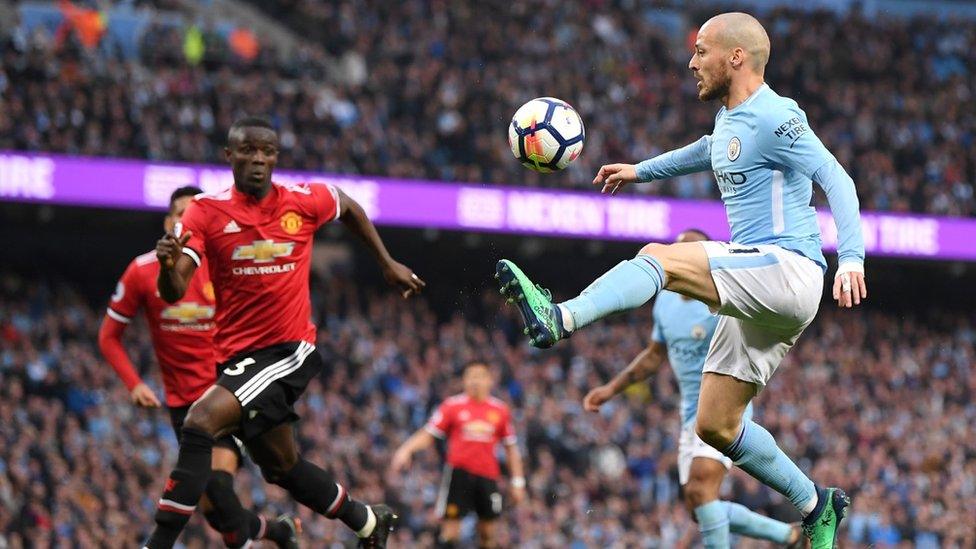 David Silva of Manchester City controls the ball during the Premier League match between Manchester City and Manchester United at Etihad Stadium