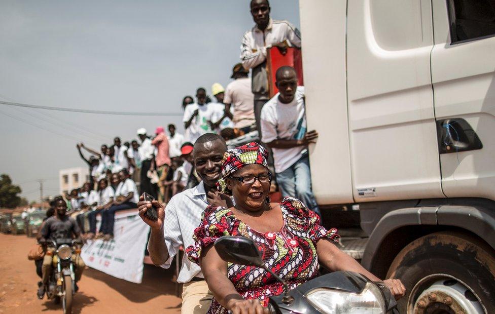 Supporters of the President of the National Council for Transition in Central African Republic Alexandre-Ferdinand N"Guendet, a presidential candidate, parade on a truck through the streets of Bangui on December 12, 2015