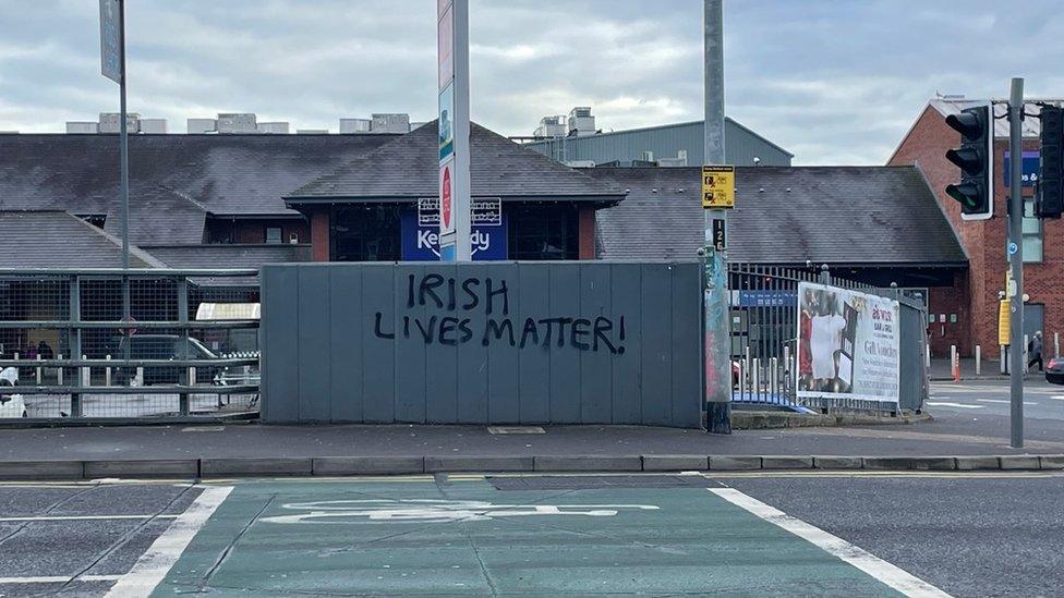 Graffiti reading Irish lives matter at the Kennedy Centre on the Falls Road