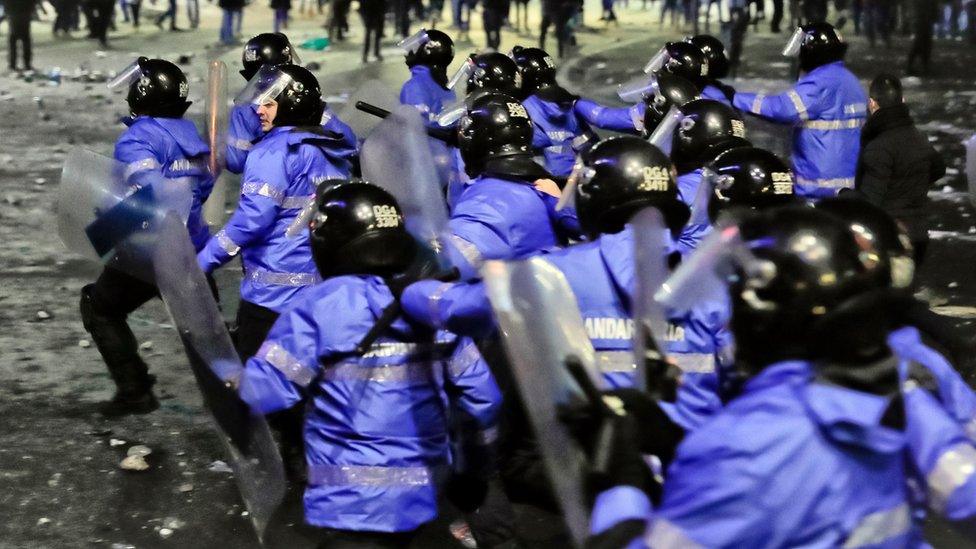 Romanian riot police charge after minor clashes erupted during a protest in Bucharest, Romania