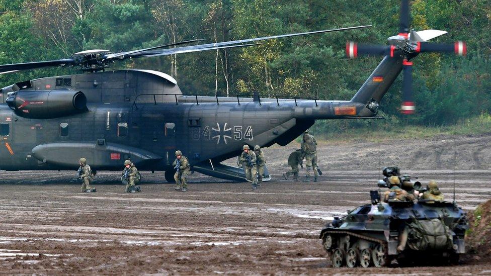 A CH-53 heafy-lift transport helicopter of the German armed forces Bundeswehr operates in the context of an informative educational practice "Land Operation Exercise 2017" at the military training area in Munster, northern Germany.