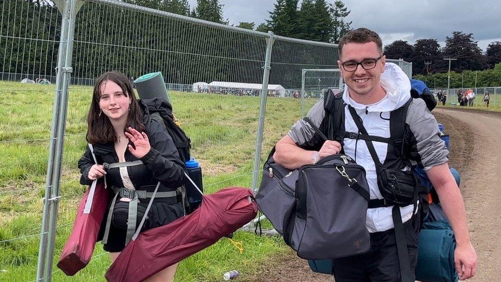 A woman and man with camping equipment