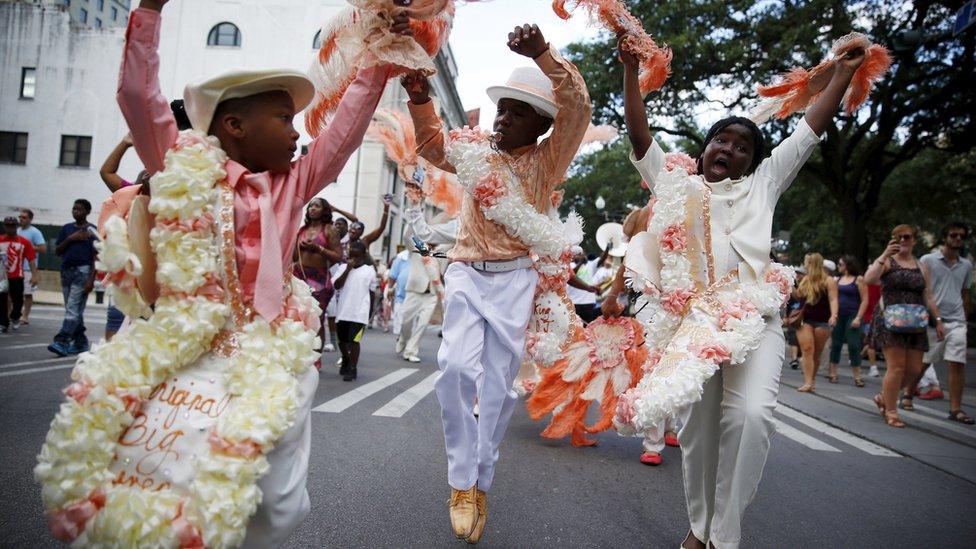 The Original Big 7 Junior Steppers parade through the Central Business District in a second line parade to mark the tenth anniversary of Hurricane Katrina in New Orleans, Louisiana August 29, 2015.