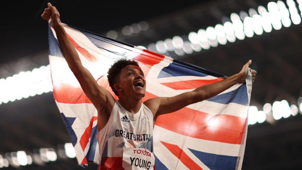 thomas-young-celebrates-while-holding-the-union-jack