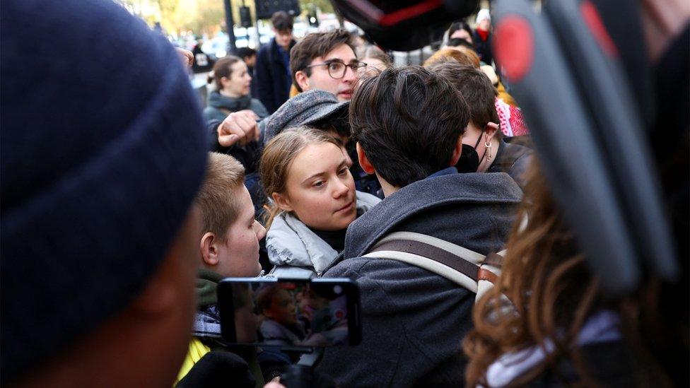 Greta Thunberg in media scrum as she leaves court