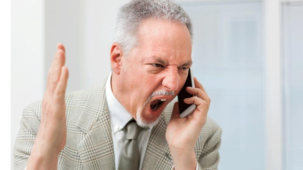 Man shouting down phone