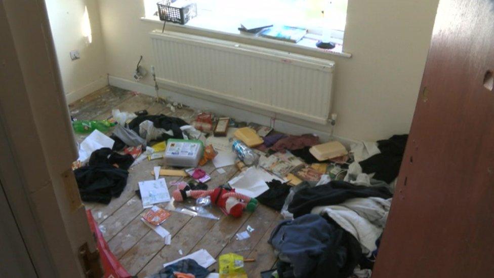 Rubbish-strewn room