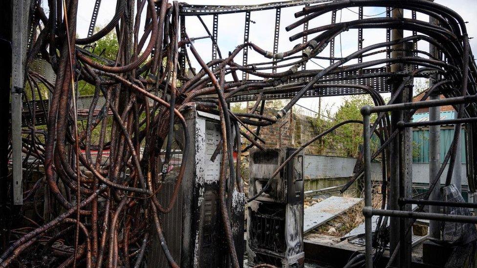 The burned out cabling system of a destroyed communications junction