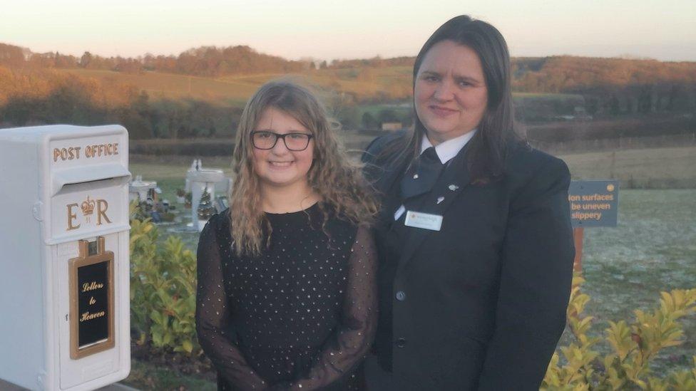 Matilda and her mum Leanne in front of the first memorial box