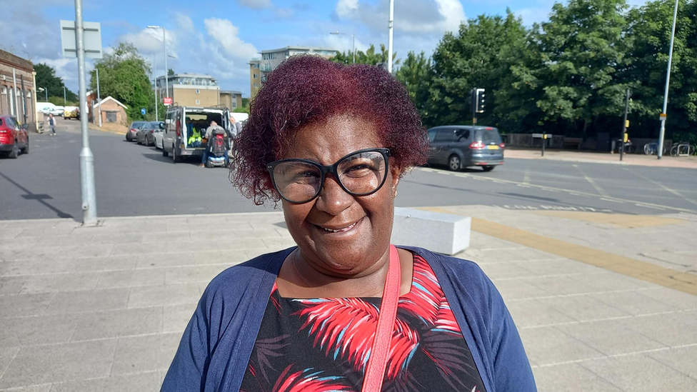 Denise Walton in front of Ipswich rail station