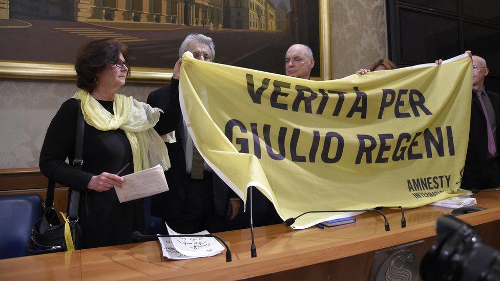 Giulio Regeni's mother (L) and father (R) with a banner demanding truth about their son's murder