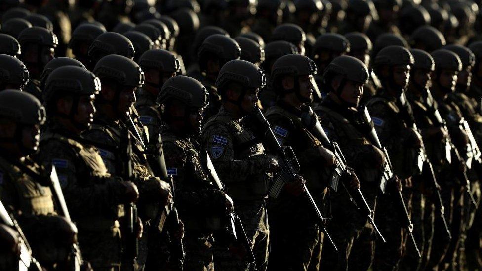 Members of the military stand in formation as the government of El Salvador presented 14,000 military personnel as part of the Territorial Control Plan for public security, in Ciudad Arce, El Salvador, 23 November 2022.