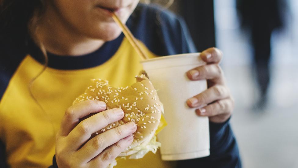 Girl eating fast food