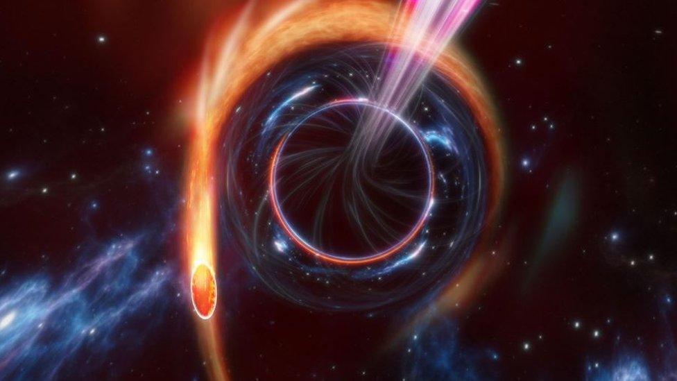 Artist's impression of a tidal disruption event where a star is being torn apart by a supermassive black hole