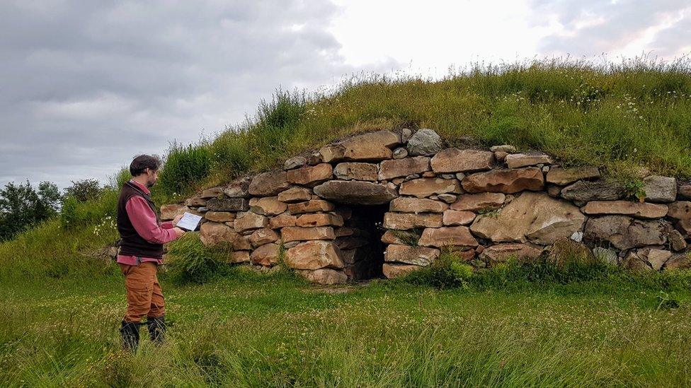 Tim Daw in front of the long barrow