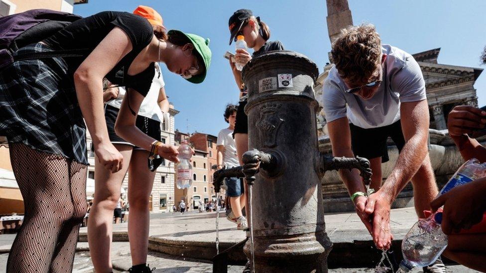 People cool off at a fountain in Rome - 31 July