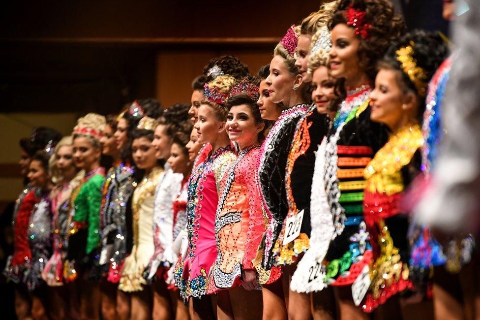 A row of dancers on stage