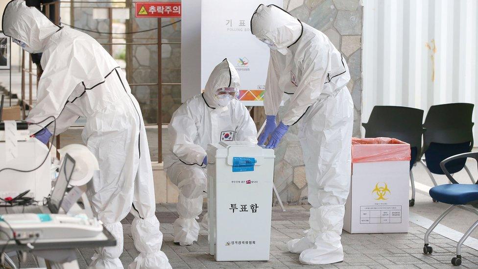 Election workers with full PPE