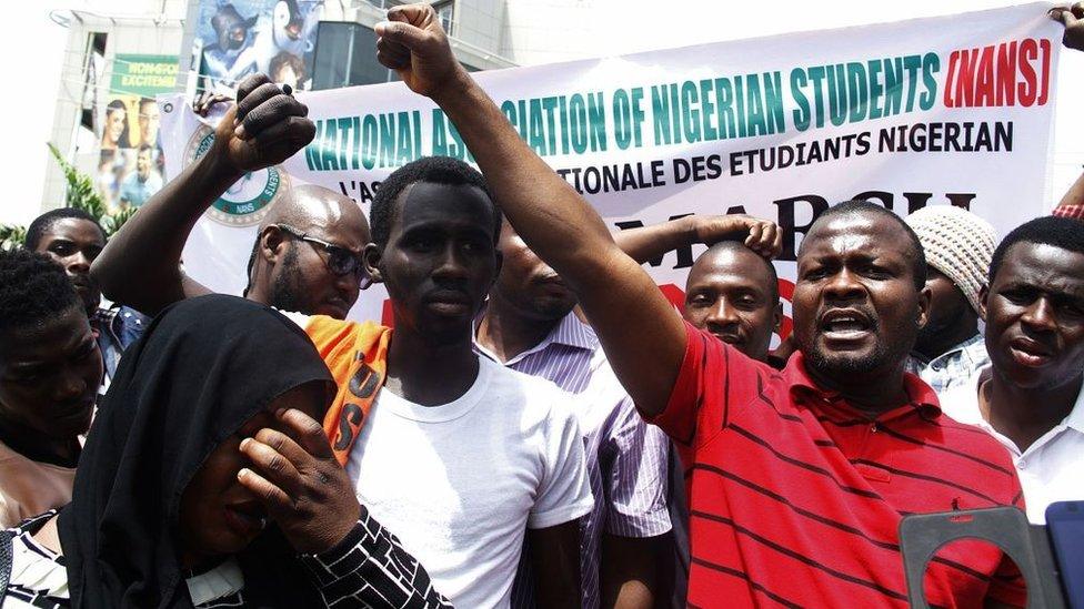 Nigerian students shout slogans against South Africa as they protest outside the South African Digital Satellite TV's (DSTV) Nigerian headquarters in Abuja against the recent spike in attacks targeting foreign nationals in South Africa on February 23, 2017