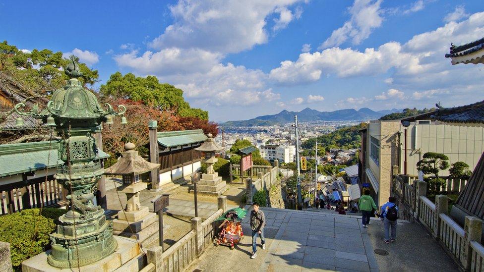 The steps leading up to Korohira shrine with a panorama in the background