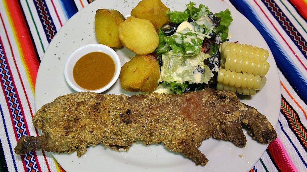 A baked guinea pig, or cuy, is served at a regional Andean restaurant in Lima