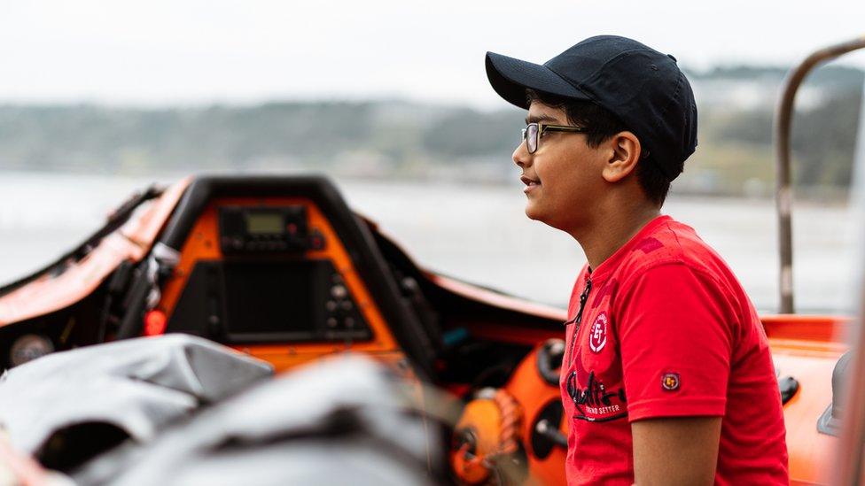 Ravi Saini sitting in a lifeboat