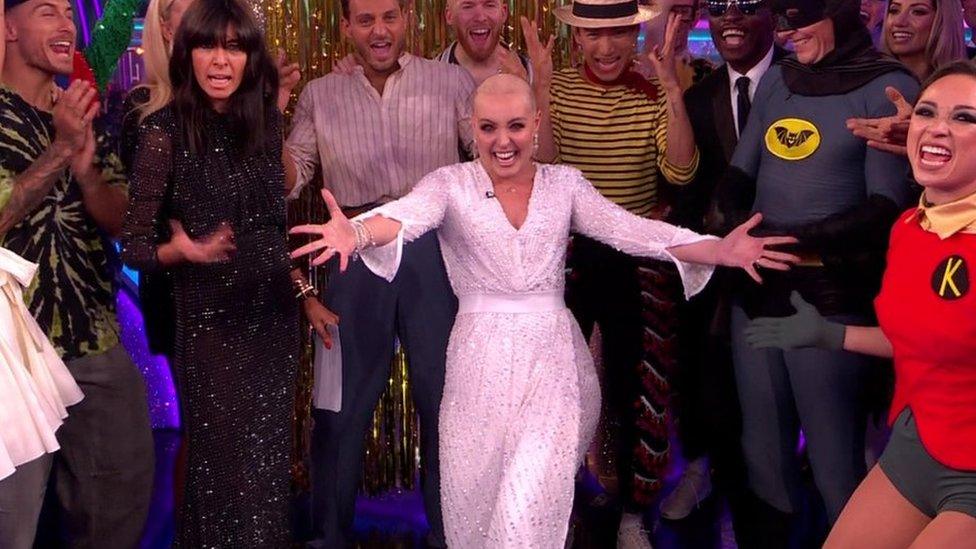 Amy Dowden surrounded by this year's Strictly Come Dancing cast during her surprise appearance