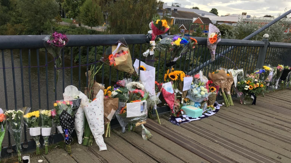 Flowers left at the canal in Worcester