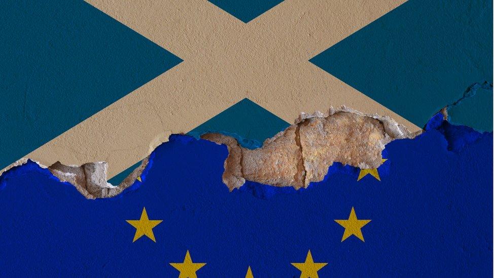 Damaged Saltire and European Union flag