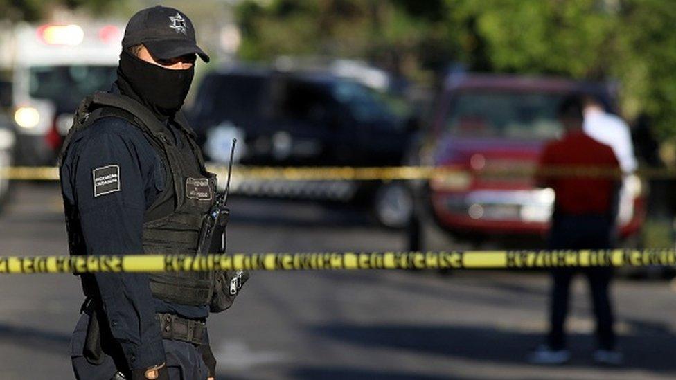 A police officer stands guard in Guadalajara, Mexico