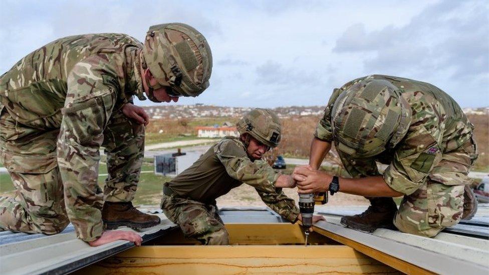 Marines mending roof