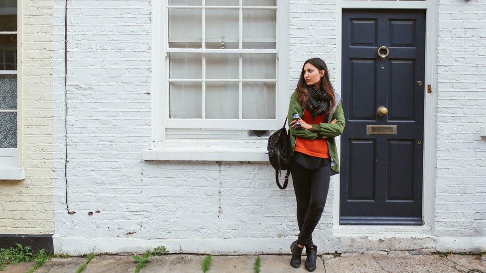 woman outside house