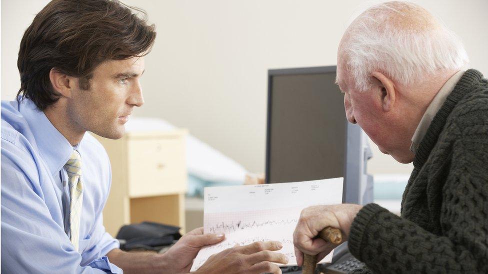 Doctor and male older patient