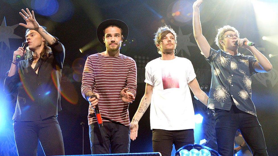 Singers Harry Styles, Louis Tomlinson, Liam Payne and Niall Horan of musical group One Direction performs onstage during 106.1 KISS FM's Jingle Ball