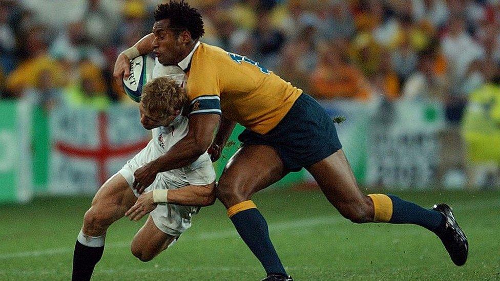 Australia's Lote Tuqiri tackles England's Josh Lewsey in the 2003 Rugby World Cup Final played at the Telstra Stadium,Saturday