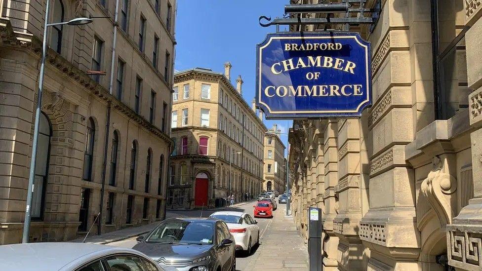 A view of a street in the Little Germany area of Bradford, with a sign reading Bradford Chamber of Commerce.