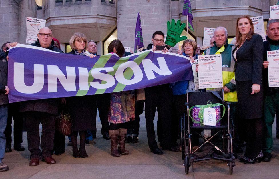 Angela Rayner with members of Unison and protesters from Save Our Ambulance Service on their way to the Department of Health. They hold a purple sign reading Unison.