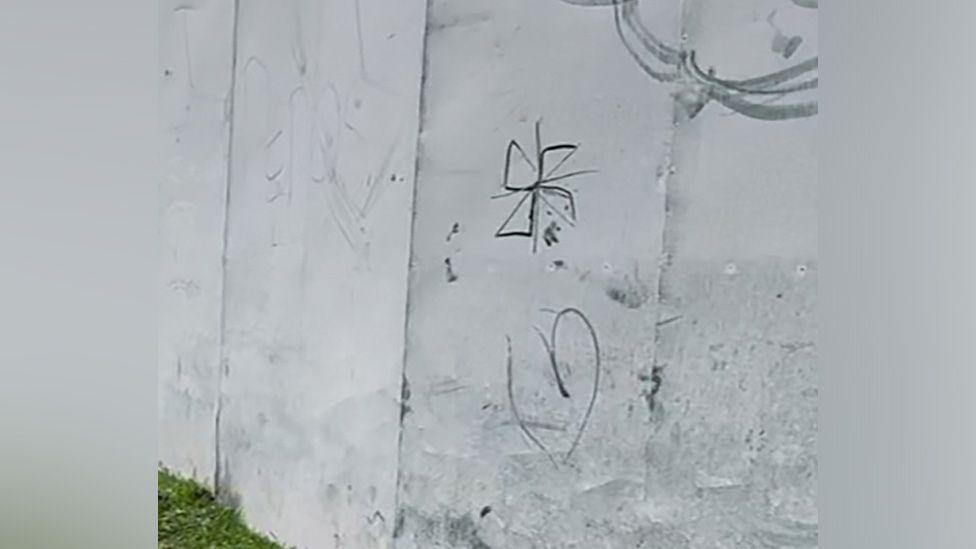 The swastika-like symbol on a metal fence on Blackpool Road, Preston