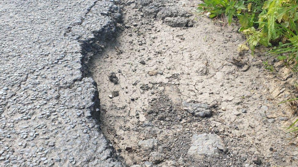 The pothole that damaged Mr Broadbent's car on a country road