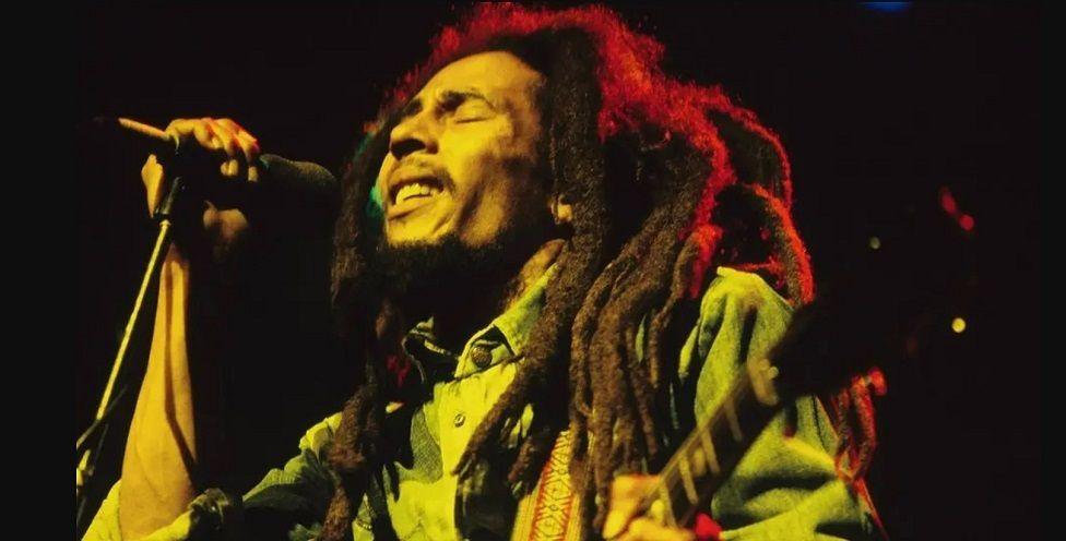 Bob Marley singing into a microphone