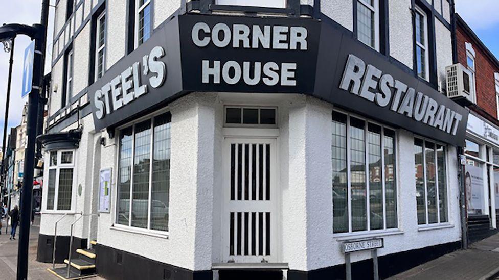 The black and white exterior of Steels restaurant, which occupies a corner plot in Cleethorpes