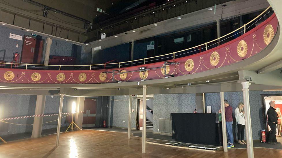 Interior of Oldham Coliseum theatre showing decorative balcony