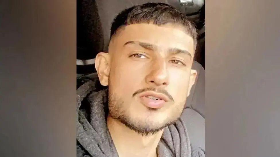 Aurman Singh, wearing a beard and brown hoody and coat