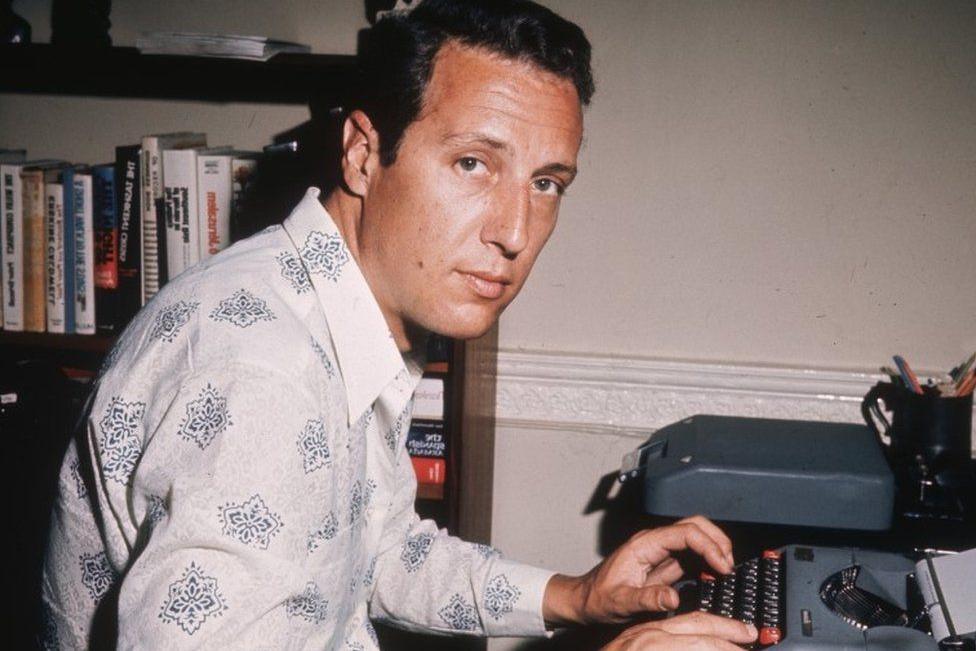Frederick Forsyth in 1970. He is at a typewriter in his study.