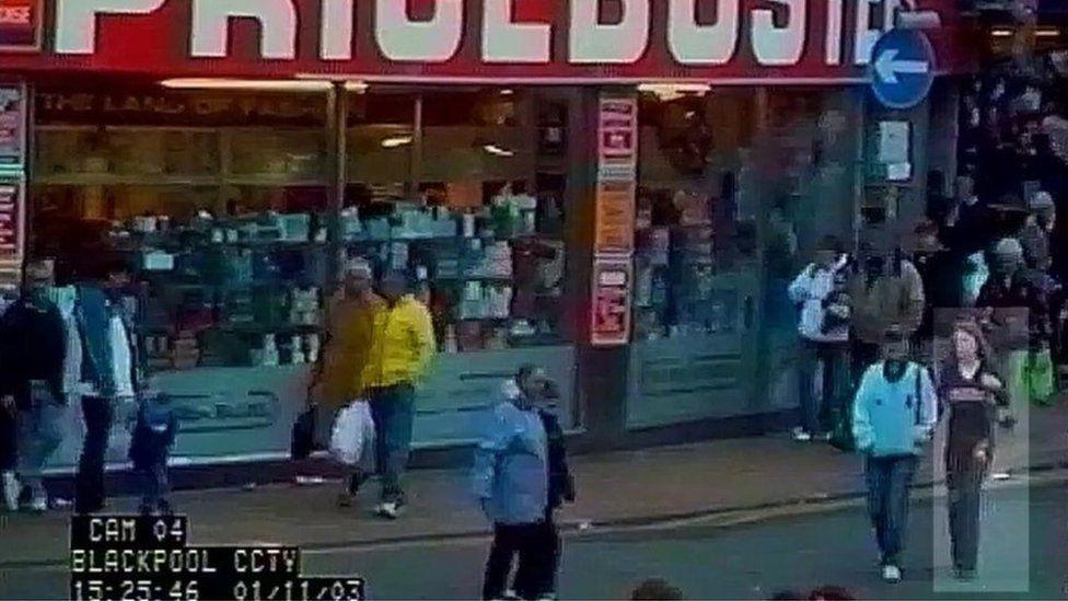 CCTV stills showing Charlene, dressed in a black top and jeans, walking arm-in-arm with her sister on a crowded street in front of a shop with a red sign.