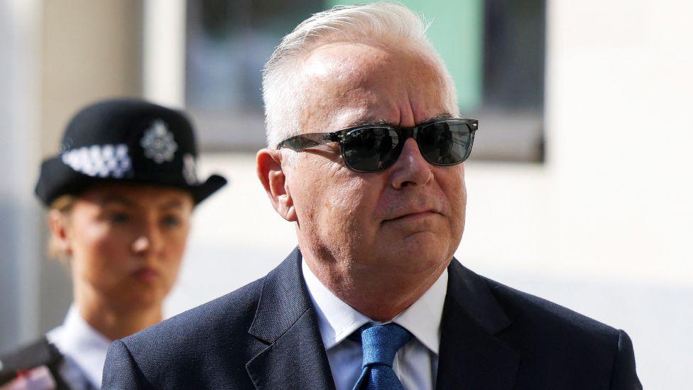 Former BBC news presenter Huw Edwards walks outside Westminster Magistrates' Court after being charged with indecent child picture crimes on the day of a hearing, in London, Britain, July 31, 2024