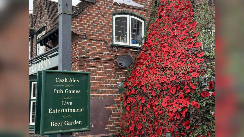 Handmade poppies where displayed outside the Cricketers Arms pub in Fair Oak.