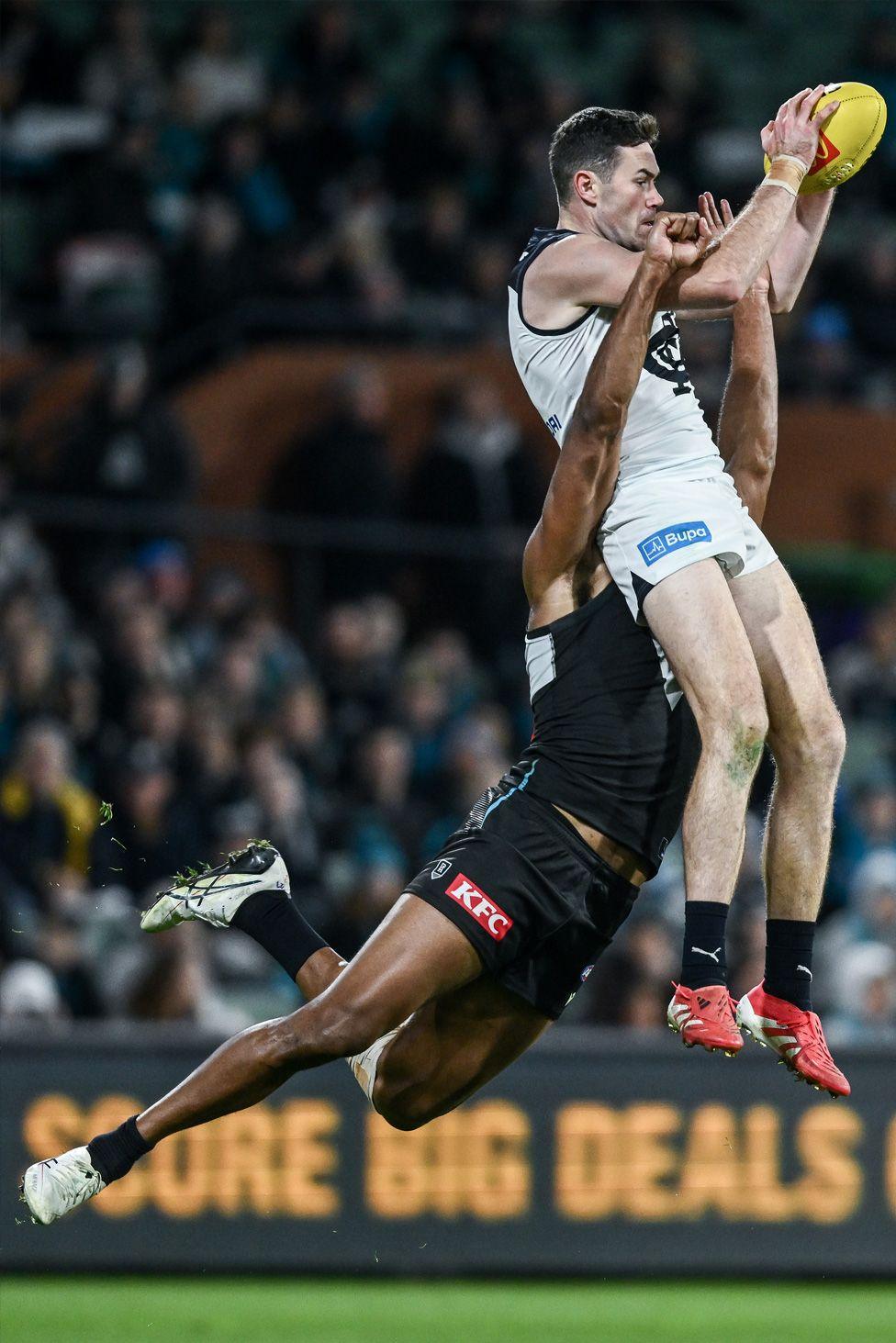 Mitch McGovern of the Blues marks in front of Esava Ratugolea in the game against Port Adelaide Power in Adelaide. Photo by Mark Brake